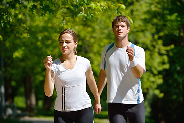 Image showing Young couple jogging