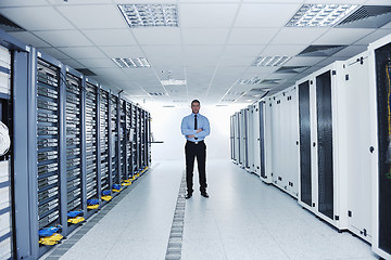 Image showing young it engineer in datacenter server room
