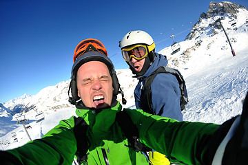 Image showing winter portrait of friends at skiing