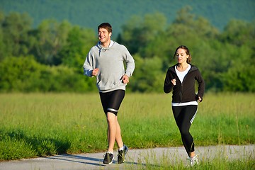 Image showing Young couple jogging