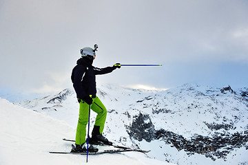 Image showing skiing on fresh snow at winter season at beautiful sunny day