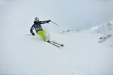 Image showing skiing on fresh snow at winter season at beautiful sunny day