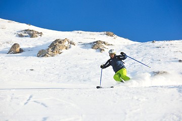 Image showing skiing on fresh snow at winter season at beautiful sunny day