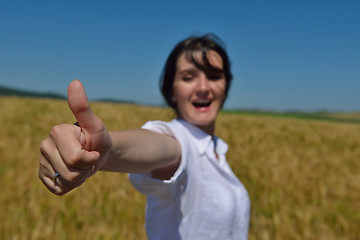 Image showing young woman in wheat field at summer