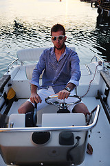 Image showing portrait of happy young man on boat