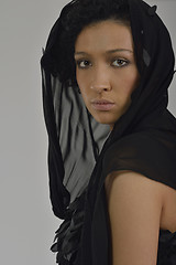 Image showing elegant woman in fashionable dress posing in the studio