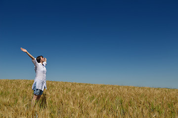 Image showing young woman in wheat field at summer