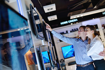 Image showing Young couple in consumer electronics store