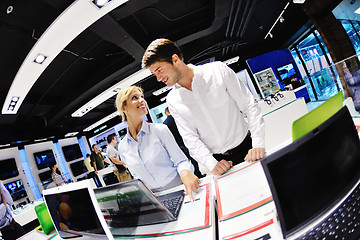 Image showing Young couple in consumer electronics store