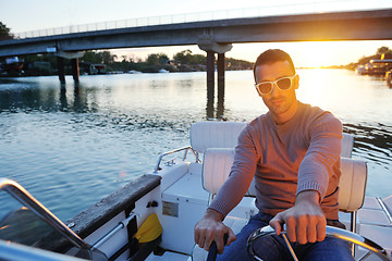 Image showing portrait of happy young man on boat