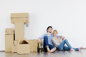 Image showing Young couple moving in new house