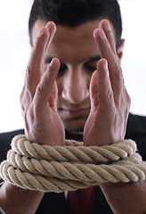 Image showing business man with rope isolated on white background