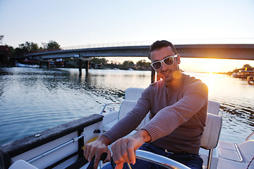 Image showing portrait of happy young man on boat