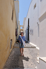 Image showing Greek woman on the streets of Oia, Santorini, Greece