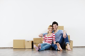 Image showing Young couple moving in new house