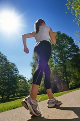 Image showing Young beautiful  woman jogging at morning in park