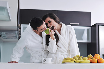 Image showing young couple have fun in modern kitchen