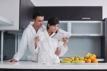 Image showing young couple have fun in modern kitchen