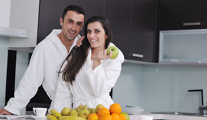 Image showing young couple have fun in modern kitchen