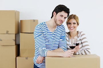 Image showing Young couple moving in new house