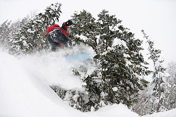 Image showing snowboarder on fresh deep snow