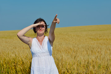 Image showing young woman in wheat field at summer