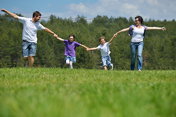 Image showing happy young family have fun outdoors