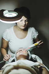 Image showing woman with facial mask in cosmetic studio