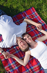 Image showing happy young couple having a picnic outdoor