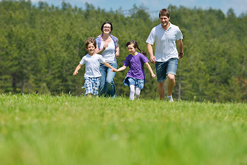 Image showing happy young family have fun outdoors