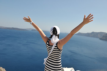 Image showing Greek woman on the streets of Oia, Santorini, Greece