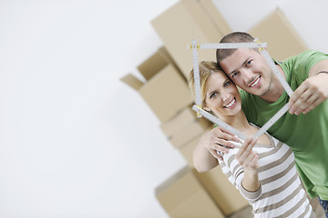 Image showing Young couple moving in new home