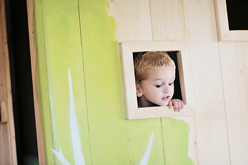 Image showing happy child in a window