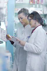 Image showing team of pharmacist chemist woman  in pharmacy drugstore