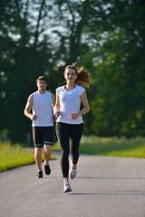 Image showing Young couple jogging