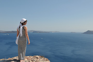 Image showing Greek woman on the streets of Oia, Santorini, Greece