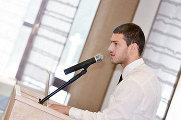 Image showing Young  business man giving a presentation on conference