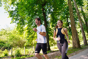 Image showing Young couple jogging