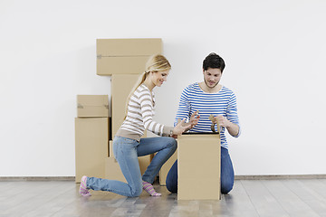 Image showing Young couple moving in new home