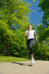 Image showing Young beautiful  woman jogging