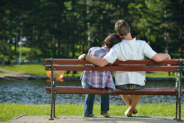 Image showing Portrait of romantic young couple smiling together outdoor