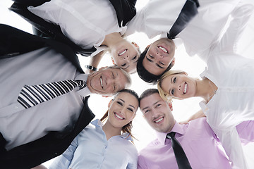 Image showing business people with their heads together