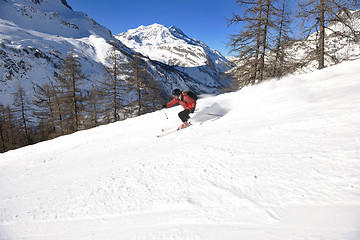 Image showing skiing on fresh snow at winter season at beautiful sunny day