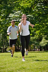 Image showing Young couple jogging