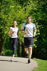 Image showing Young couple jogging