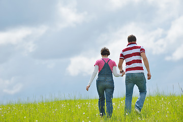 Image showing Portrait of romantic young couple smiling together outdoor