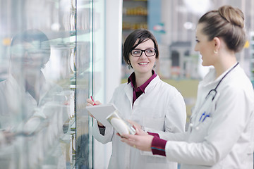 Image showing team of pharmacist chemist woman  in pharmacy drugstore