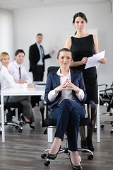 Image showing business woman with her staff in background