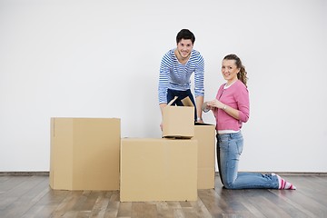 Image showing Young couple moving in new home