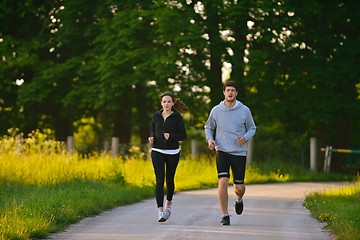 Image showing Young couple jogging